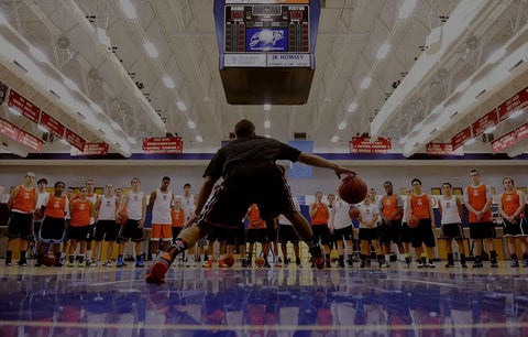 Alum Mano Watso demonstrates basketball skills at his youth sports academy.