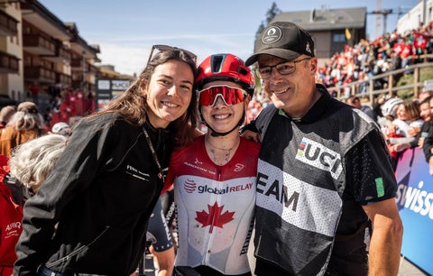 Rob Holmgren and daughters at finish line at mountain biking worlds in 2025.