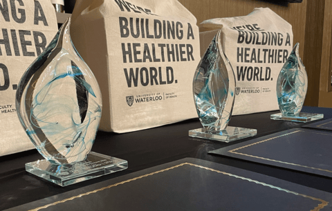 Crystal alumni award statues and gift bags.