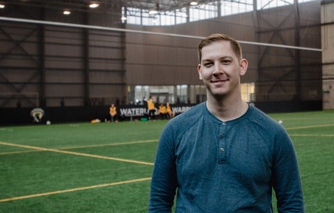 Chad Van Dyk stands on Waterloo Field.