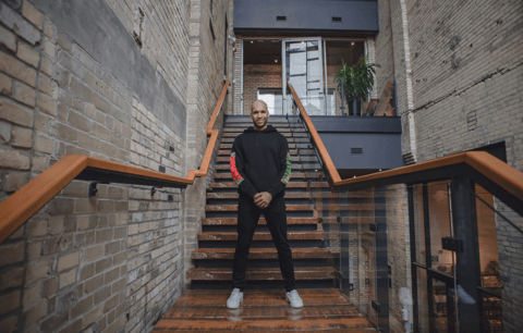 Marc Lafleur stands on staircase landing.