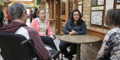 Two students studying and discussing together.
