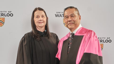 Caryl Russell and Albert Wong wearing convocation robes.