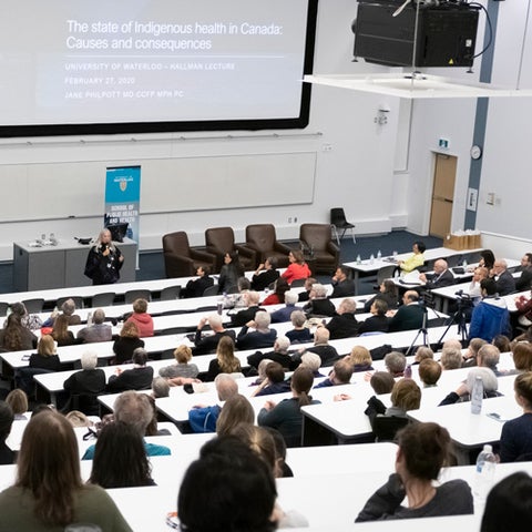 People sitting in a lecture hall.