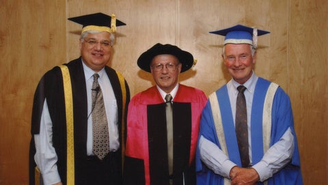 Ron Schlegel, Mike Lazardis and the Honourable David Johnson in convocation robes.