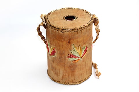The birch bark tobacco holder displayed in the display case is an example of one of the ways tobacco is stored.