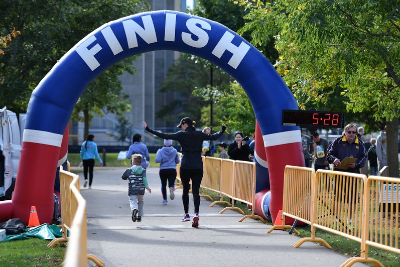 Participants running through finish line