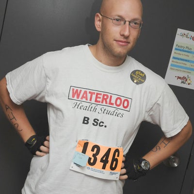 A man wearing Waterloo Health Studies t-shrit with number 1346 