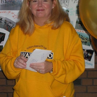 A female opening an envelope