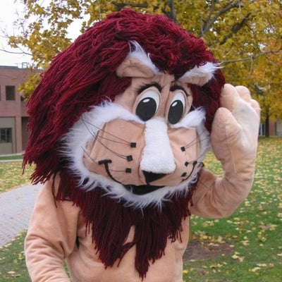 A lion mascot saying hi by waving hands