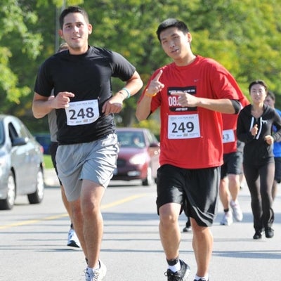 Two runners smiling towards the camera