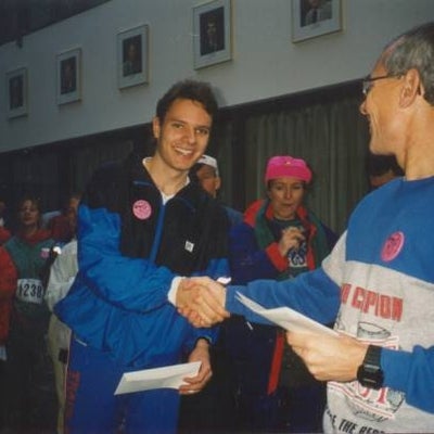 Two men shaking hands after the race. 