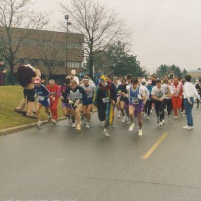 Race began and people with various costumes are running.