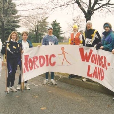 Eight people holding a sign "Nordic Wonderland"