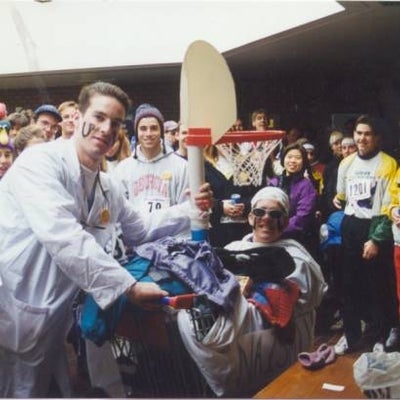 Two participants in doctor and patient costume surrounded by other participants