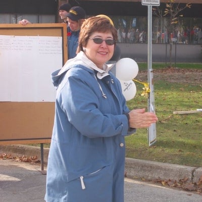 A female staff member with sunglasses 