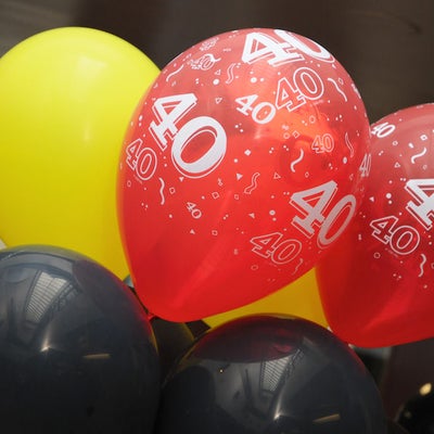 Black, yellow and red balloons with number 40 written 