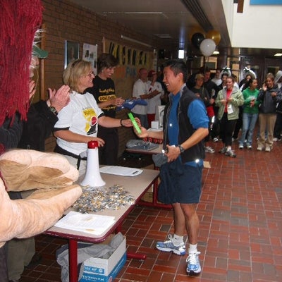 A man getting one of the merchandise products 