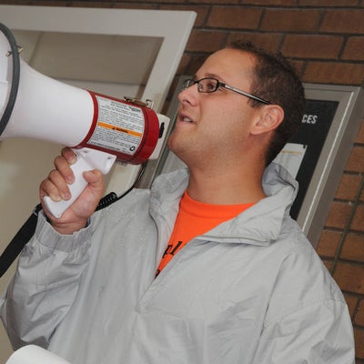 A man speaking through a megaphone