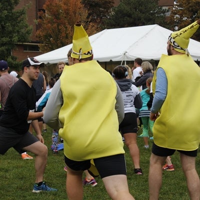 Two racers dressed up in a banana costume 