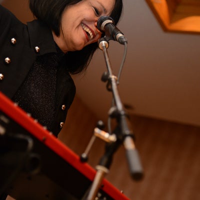 Close-up of singer and pianist. 