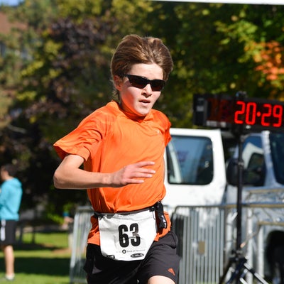 Child Participant passing the finish line