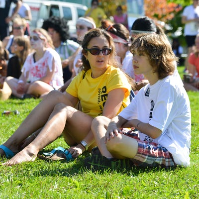 Participants sitting on grass after run