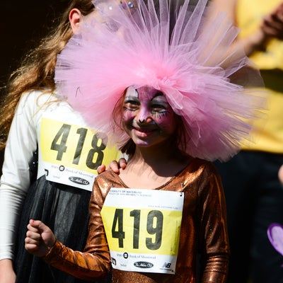 Child participant in costume after run