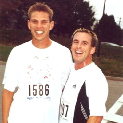Two male runners staring at the camera smiling