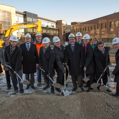 Employees of Melloul-Blamey Construction breaking ground alongside UWaterloo Administration and staff members.