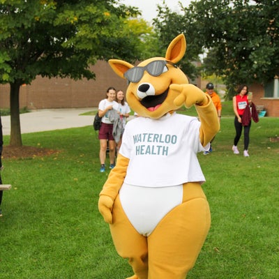 Aussie posing with a peace hand sign