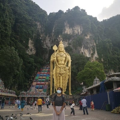 Standing in front of Lord Murugan’s statue