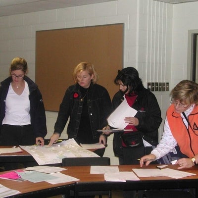 Four females organizing documents