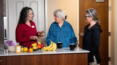 Heather Keller chats about calories while holding a muffin.