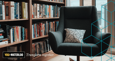 grey upholstered empty chair in a library
