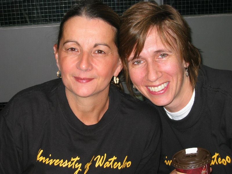 Two females in University of Waterloo t-shirts smiling