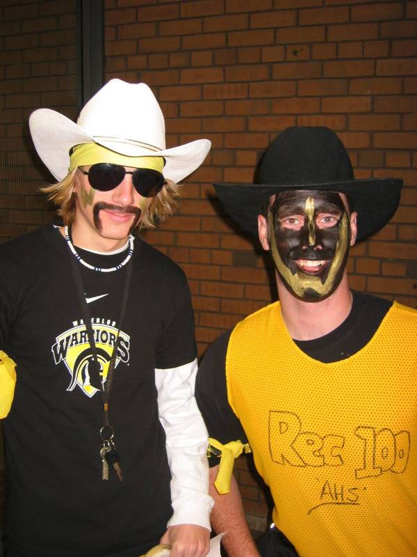Two male participants with costumes and face painting