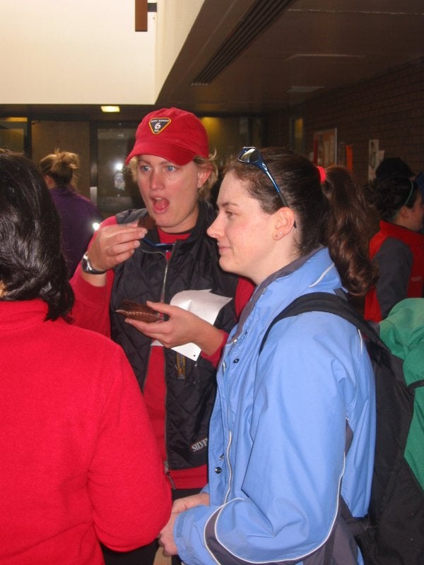 Females talking and eating snacks before the race at meeting room