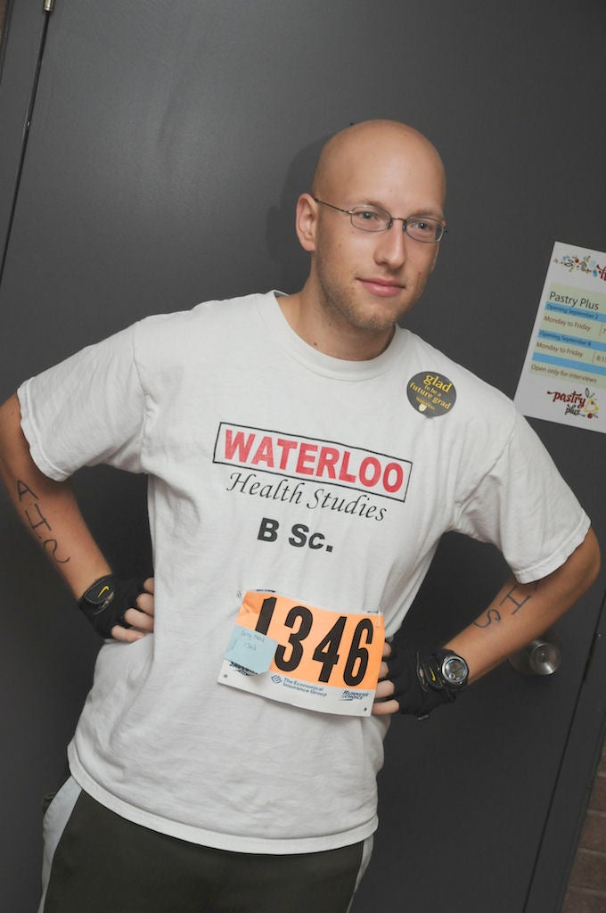 A man wearing Waterloo Health Studies t-shrit with number 1346 