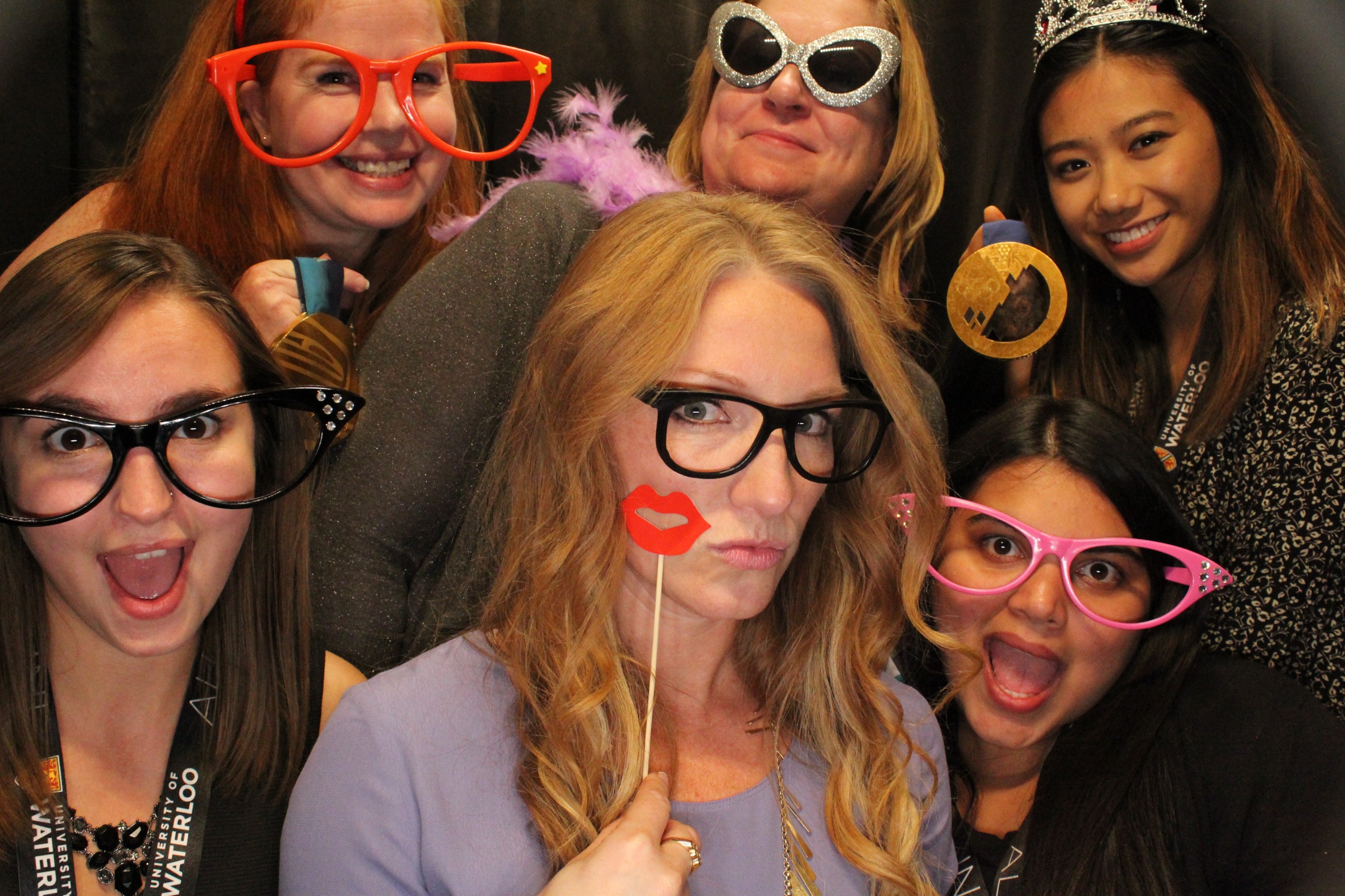 Attendees in photo booth with Heather Moyse