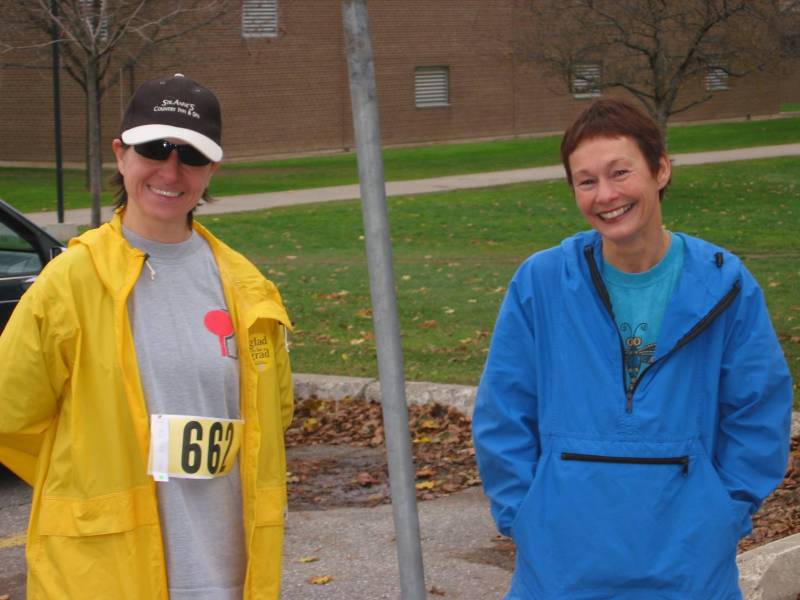 Two female runners smiling towards the camera