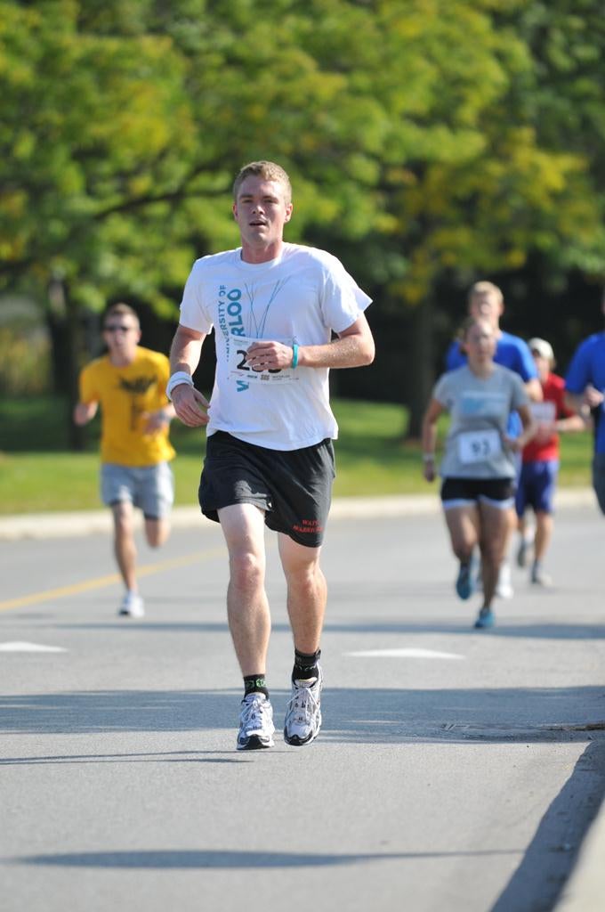 Runner with University of Waterloo t-shirt running