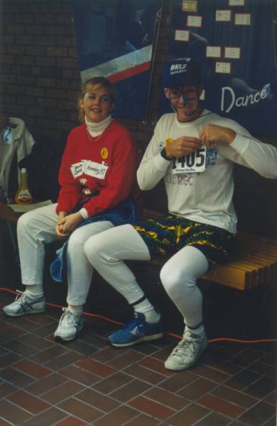 Two participants sitting on a bench waiting for the race to start