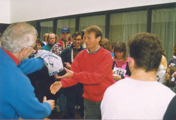 A man receiving a shirt after the race