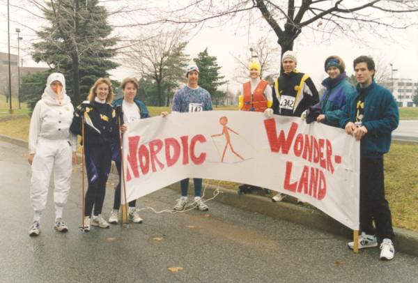 Eight people holding a sign "Nordic Wonderland"
