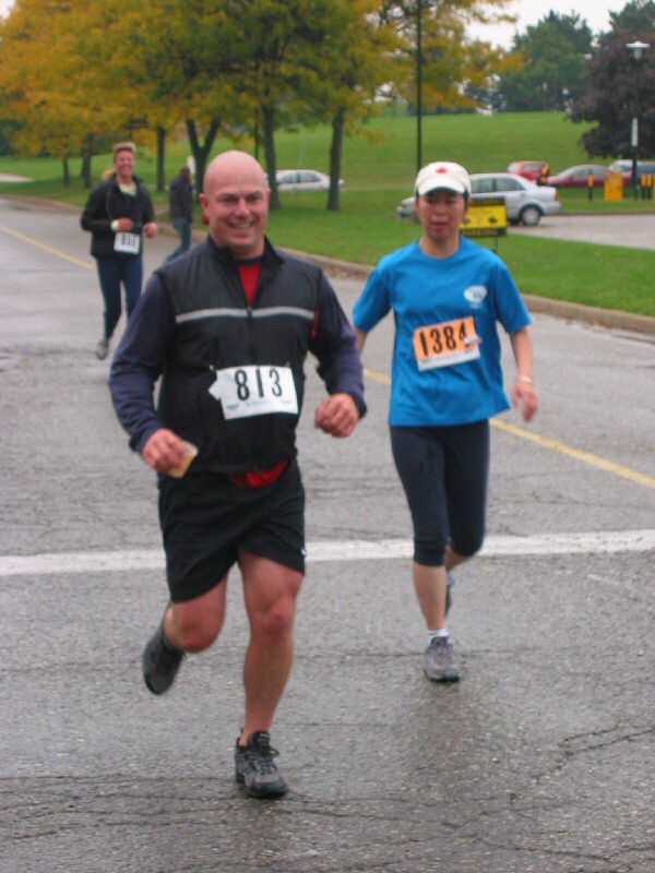 Two participants running in the front and one more runner behind them
