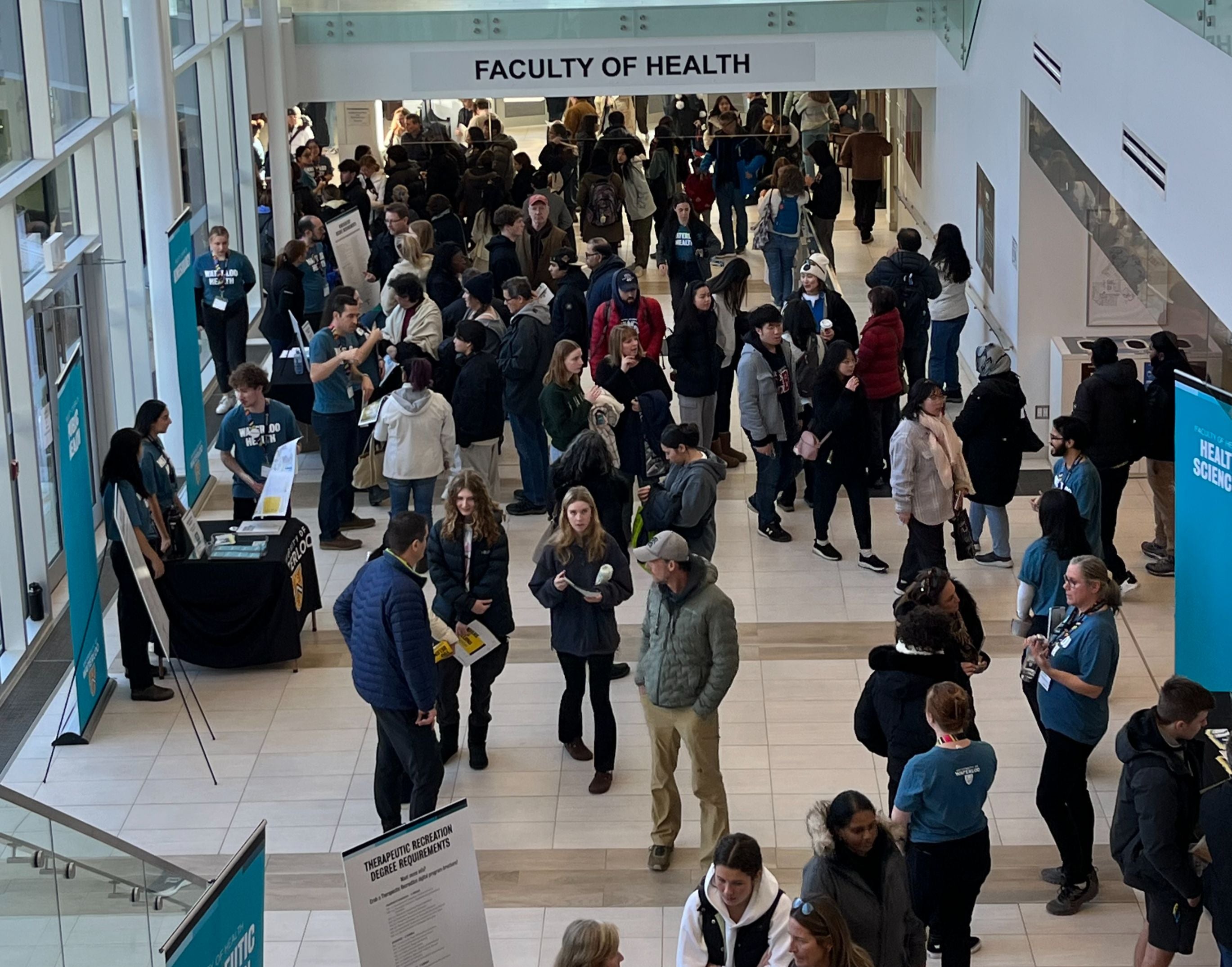 A crowd of students and their families in the Faculty of Health Expansion building.