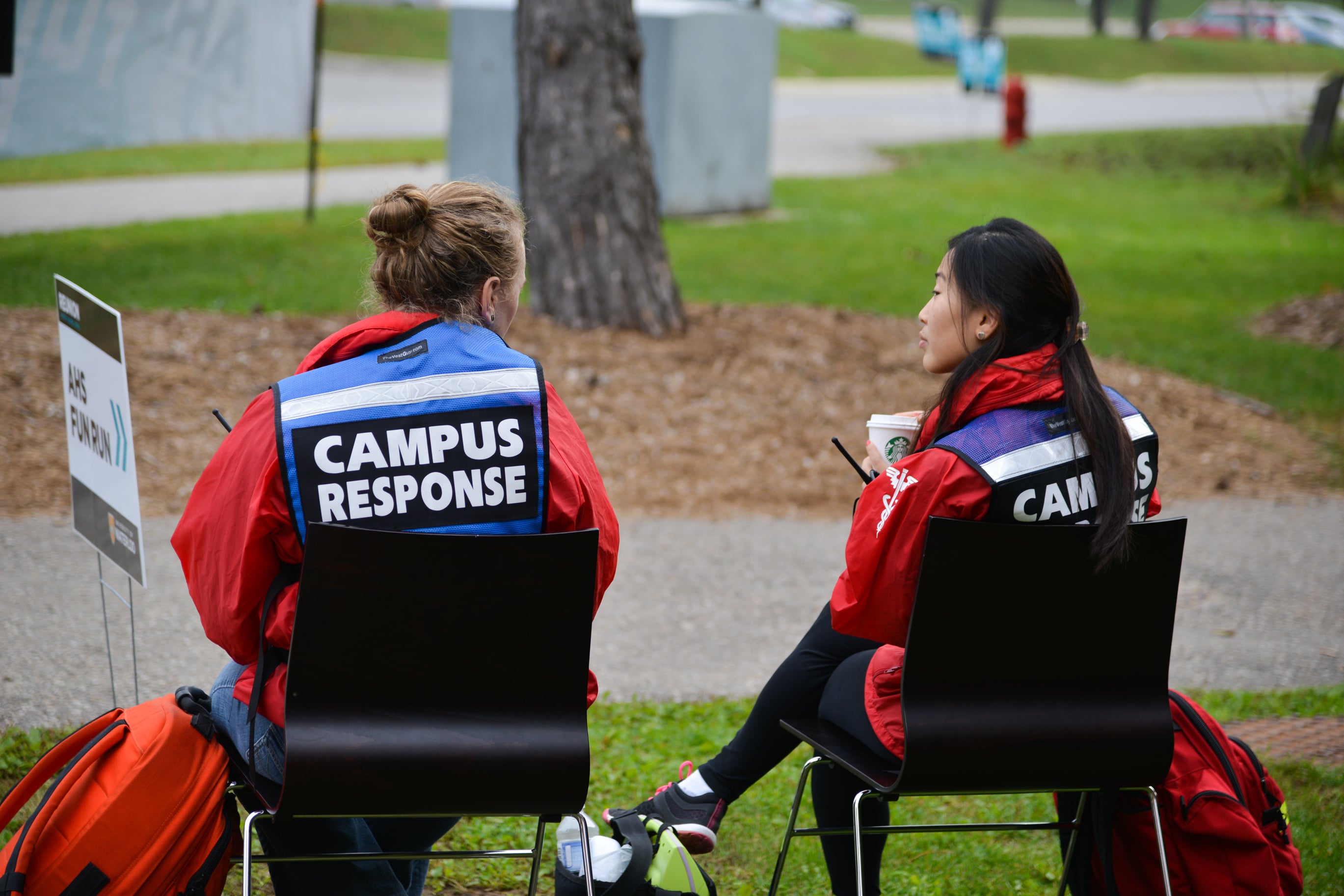 Two campus response team members sitting on chairs.