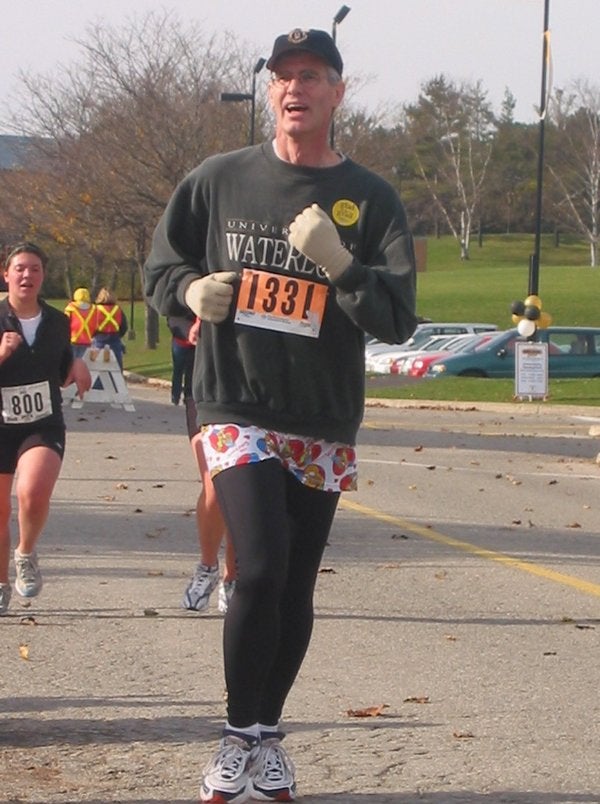 A man running wearing leggings and a skirt