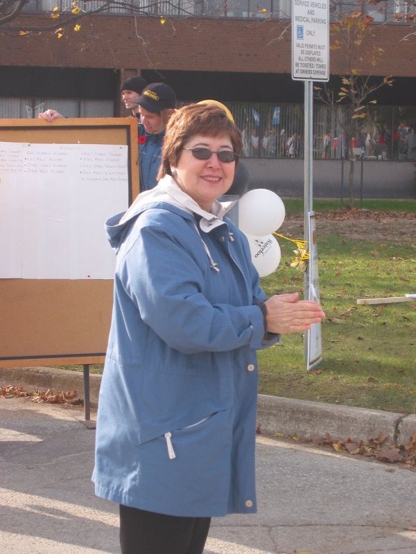 A female staff member with sunglasses 